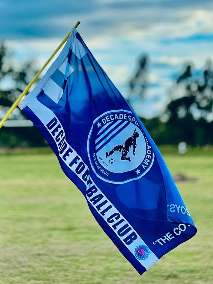 Decade Football Club flag flying on the pitch